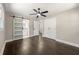 Bedroom showcasing a barn door, hardwood floors, ceiling fan, and closet at 2682 Miriam Ln, Decatur, GA 30032