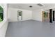 Spacious carport with brick accent and fresh gray floor, offering ample parking space at 2682 Miriam Ln, Decatur, GA 30032