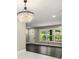 Dining area featuring a chandelier and large window overlooking the front yard at 2682 Miriam Ln, Decatur, GA 30032