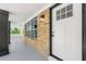 Inviting entrance features a stone accent wall and a modern black trimmed door at 2682 Miriam Ln, Decatur, GA 30032