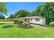 Well-maintained lawn with decorative landscaping and shrubs around the perimeter of the house at 2682 Miriam Ln, Decatur, GA 30032