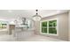 Modern kitchen with white cabinets, a crystal chandelier, and stainless steel appliances at 2682 Miriam Ln, Decatur, GA 30032