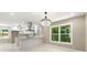 Modern kitchen with white cabinets, stainless steel appliances, and a stylish chandelier at 2682 Miriam Ln, Decatur, GA 30032