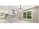 Bright, renovated kitchen with white cabinetry, an island, stainless steel appliances, and tiled floors at 2682 Miriam Ln, Decatur, GA 30032