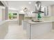 Bright kitchen with updated stainless steel appliances and an island with bar seating at 2682 Miriam Ln, Decatur, GA 30032