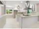 Modern white kitchen with stainless steel range hood and white tile backsplash at 2682 Miriam Ln, Decatur, GA 30032