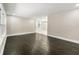 Open-concept living room with dark hardwood floors and plenty of natural light at 2682 Miriam Ln, Decatur, GA 30032