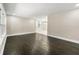Open-concept living room featuring hardwood floors, ample natural light, and neutral paint at 2682 Miriam Ln, Decatur, GA 30032