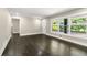 Bright living room featuring hardwood floors, large windows, and ample space for furniture at 2682 Miriam Ln, Decatur, GA 30032