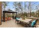 Large back deck featuring comfortable seating, a grill, and a dining area at 2871 Parkridge Ne Dr, Brookhaven, GA 30319