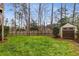 Well-manicured backyard with a shed, lush lawn, and a privacy fence at 2871 Parkridge Ne Dr, Brookhaven, GA 30319