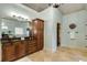 Bright bathroom with a shower, vanity, large mirror, and a tiled floor at 2871 Parkridge Ne Dr, Brookhaven, GA 30319