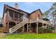 Exterior of home featuring an expansive deck, patio, and well-maintained yard at 2871 Parkridge Ne Dr, Brookhaven, GA 30319