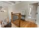 Elegant staircase leading to the upper level, showcasing hardwood floors and stylish lighting at 2871 Parkridge Ne Dr, Brookhaven, GA 30319