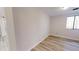 Bright bedroom featuring durable and stylish light-colored wood flooring and a window allowing natural light at 300 Johnson Ferry Ne Rd # B103-105, Atlanta, GA 30328