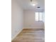 Bedroom featuring a window, wood-look flooring, and neutral walls at 300 Johnson Ferry Ne Rd # B103-105, Atlanta, GA 30328