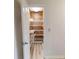 Walk-in closet with custom shelving and wood paneling at 300 Johnson Ferry Ne Rd # B103-105, Atlanta, GA 30328