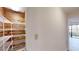 Walk-in closet with custom shelving and wood paneling at 300 Johnson Ferry Ne Rd # B103, Atlanta, GA 30328