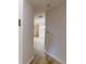 Hallway leading to a bright living area with hardwood floors at 300 Johnson Ferry Ne Rd # B103, Atlanta, GA 30328