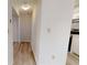 Hallway that features a wood-look floor and neutral walls leading to the kitchen at 300 Johnson Ferry Ne Rd # B103, Atlanta, GA 30328