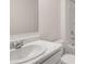 Bright bathroom featuring modern toilet, white cabinets, marble countertop, and stainless steel faucet at 617 Kimberwick Dr, Locust Grove, GA 30248