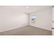 Bedroom featuring neutral carpet, a single window, and white walls at 617 Kimberwick Dr, Locust Grove, GA 30248