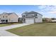 Exterior shot of the two-story home with an attached two-car garage at 617 Kimberwick Dr, Locust Grove, GA 30248