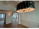 Bright dining room showcasing decorative lighting, wainscoting, and hardwood floors at 1366 Wessyngton Ne Rd, Atlanta, GA 30306