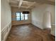 Bright dining room showcasing coffered ceilings, wainscoting, and hardwood floors at 1366 Wessyngton Ne Rd, Atlanta, GA 30306