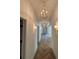 Elegant hallway featuring herringbone wood floors and modern gold lighting fixtures at 1366 Wessyngton Ne Rd, Atlanta, GA 30306