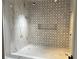 Luxurious shower with designer tile work, a built-in niche, and high-end fixtures at 1366 Wessyngton Ne Rd, Atlanta, GA 30306
