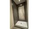 Modern shower featuring gray tile, a marble accent wall, and a mosaic tile floor at 1366 Wessyngton Ne Rd, Atlanta, GA 30306