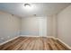 This basement features wood floors, white trim and neutral paint at 1492 Cobb Branch Dr, Decatur, GA 30032