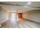 Spacious basement featuring walk-out access, wood floors and block walls at 1492 Cobb Branch Dr, Decatur, GA 30032