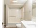 This bathroom features a tub-shower, single vanity, and great lighting at 1492 Cobb Branch Dr, Decatur, GA 30032