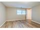 This bedroom has wood floors, natural lighting and white trim at 1492 Cobb Branch Dr, Decatur, GA 30032