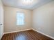 Bedroom featuring laminate flooring, neutral paint and a window at 1492 Cobb Branch Dr, Decatur, GA 30032