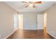 This bedroom features two windows, wood floors, and multiple closets at 1492 Cobb Branch Dr, Decatur, GA 30032