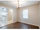 Bright dining area featuring hardwood floors, modern lighting, and a window view at 1492 Cobb Branch Dr, Decatur, GA 30032