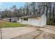 This home includes an attached garage and a long driveway at 1492 Cobb Branch Dr, Decatur, GA 30032