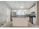 Galley kitchen featuring granite countertops and stainless steel appliances at 1492 Cobb Branch Dr, Decatur, GA 30032