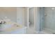 Modern bathroom featuring a glass shower, a vanity with a white countertop, and clean finishes at 4541 Moray Dr, Mableton, GA 30126