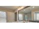 Bright bathroom with a dual sink vanity, white cabinets, and a large mirror at 4541 Moray Dr, Mableton, GA 30126