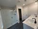 Modern bathroom with a double vanity and a glass-enclosed shower at 4541 Moray Dr, Mableton, GA 30126