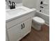 Clean bathroom with a modern sink, white cabinets, and a tiled bathtub and shower combo at 4541 Moray Dr, Mableton, GA 30126