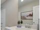 Bathroom featuring modern fixtures, framed mirror, and white countertop at 4541 Moray Dr, Mableton, GA 30126