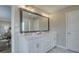 Bathroom with a dual sink vanity with a large mirror and modern fixtures at 4541 Moray Dr, Mableton, GA 30126