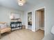 Cozy bedroom with a console table, a comfortable chair, and ample closet space at 4541 Moray Dr, Mableton, GA 30126