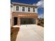 Two car garage with a concrete floor and a wooden pergola above the opening at 4541 Moray Dr, Mableton, GA 30126