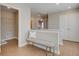 Bright hallway with a neutral bench, white railing, and easy access to the laundry room at 4541 Moray Dr, Mableton, GA 30126